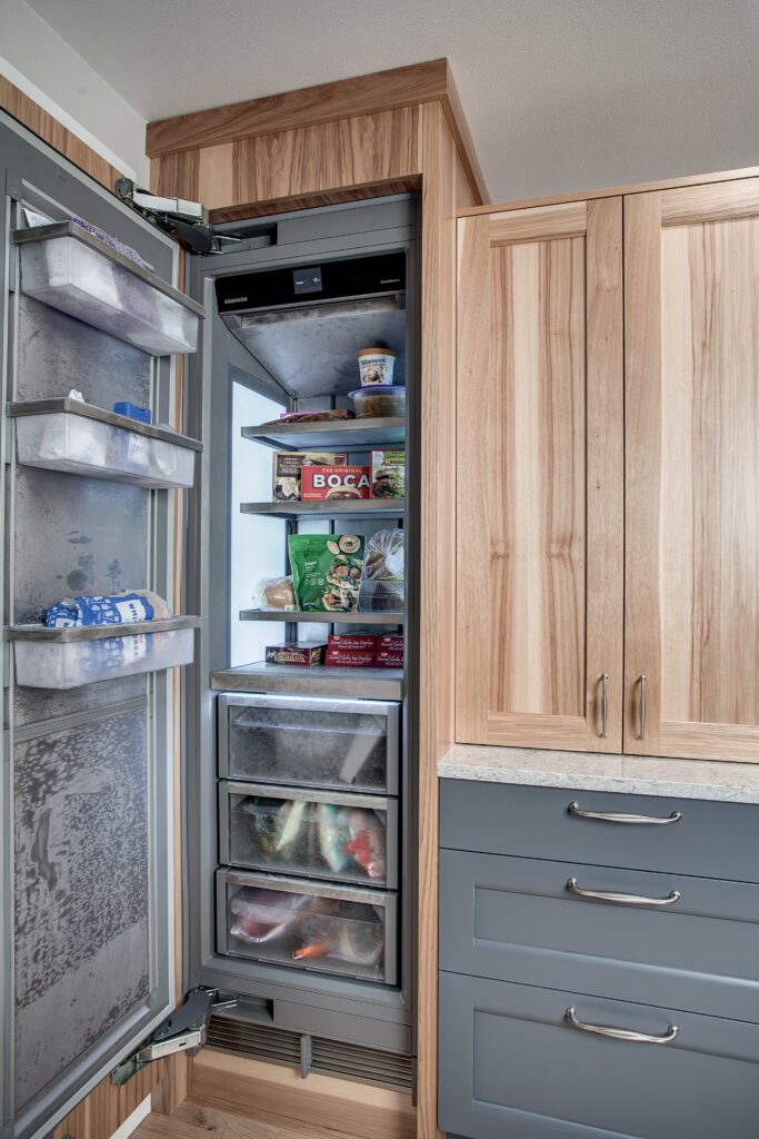 remodeling can help relieve stress by reimagining how your space is used, like this kitchen with a split freezer and fridge