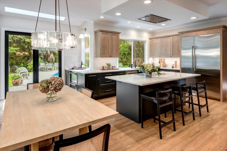 Sammamish home transition space kitchen family room dining nook beverage area and access to backyard and pool
